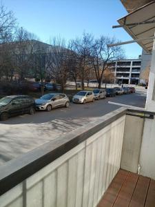 a row of parked cars in a parking lot at Karpos- City Mall in Skopje
