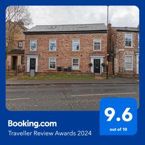 a brick building with a sign that says travel review awards at 3 Bedroom Townhouse, Free Parking in York