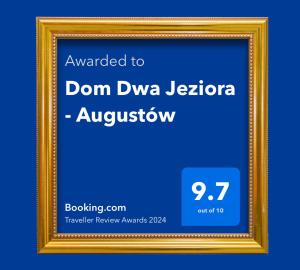 a gold picture frame with the words don dna jezori answeratown at Dom Dwa Jeziora - Augustów in Augustów