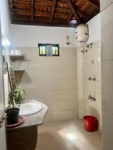a bathroom with a sink and a toilet in a room at The Sunset Chalet! in Anjuna