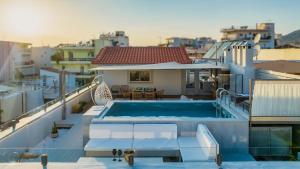 a swimming pool on the roof of a house at El Cielo Where Luxury meets the sky in Kalamata
