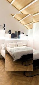 een slaapkamer met een groot bed in een kamer bij Apartamento Centro Cabildo Antiguo Convento in Sanlúcar de Barrameda