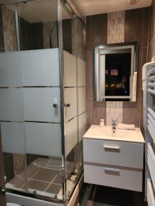 a bathroom with a shower and a sink at Logis Hôtel Restaurant les Charmettes in Argelès-sur-Mer +29 photos