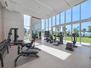 a gym with treadmills and exercise equipment in a building at 3Bed Private Beach - Belle vie à La Vie Dubai in Dubai