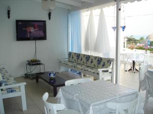 a living room with a couch and a table and chairs at No20 Hotel Sultanahmet in Istanbul