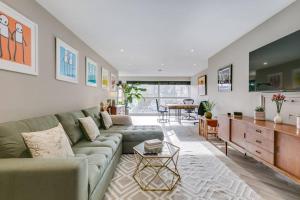 a living room with a couch and a table at Luxury 2 Bed apartment - Central Peckham near Tube in London