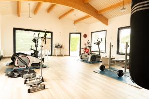 a gym with several treadmills and elliptical machines at Bontempo Village La Yole in Saint-Jean-de-Monts