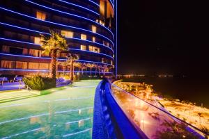 a building with a swimming pool at night at DoubleTree by Hilton Porto Alegre in Porto Alegre