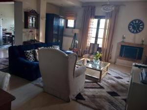 a living room with a couch and a coffee table at Dali sea view apartments in Zakynthos