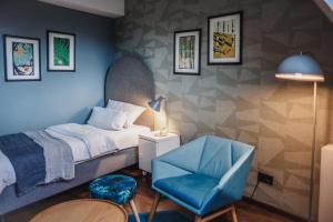 Postel nebo postele na pokoji v ubytování The Circus Hotel