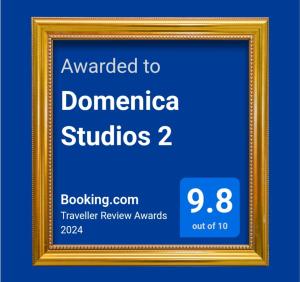a gold picture frame with the text awarded to dominicastudios at Domenica Studios 2 in Thessaloniki