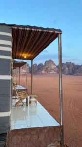 a tent in the middle of the desert at WADi RUM ALi CAMP in Wadi Rum