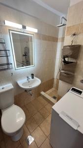 a bathroom with a toilet and a sink at MaVitaPlace Harmonia Apartment in Katerini