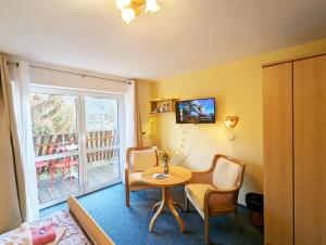 TV a/nebo společenská místnost v ubytování L9 - Urlaubsmagie - Balkon & direkt am Wanderweg + 6 fotografií