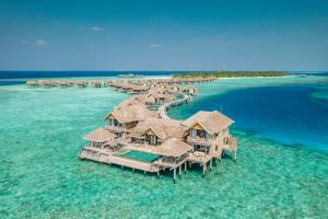 an aerial view of a resort in the ocean at Vakkaru Maldives in Baa Atoll