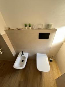a small bathroom with a sink and a toilet at Residenza Conti in Rome