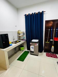 A kitchen or kitchenette at BOSS Homestay