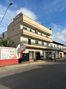 a building on the corner of a street at Mais Hotel Express in São Luís