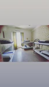 a room with two bunk beds and a hallway at Hostel Castello Maggiore in Rome