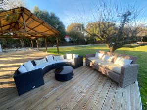 a patio with two couches and a fire pit at FINCA ALMAZARA in San Pablo