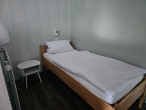 Postel nebo postele na pokoji v ubytování Gästehaus Loehnert GmbH