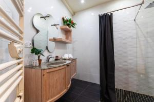 a bathroom with a sink and a shower at BAMBOO PLAGE AP4220 by Riviera Holiday Homes in Nice