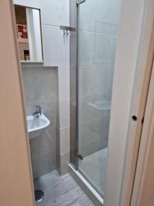 a bathroom with a shower and a sink at Alfama - Close to Everything in Lisbon