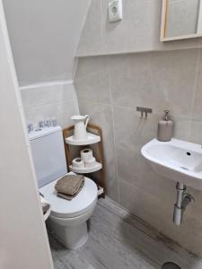 a bathroom with a toilet and a sink at Alfama - Close to Everything in Lisbon