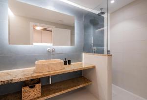 a bathroom with a sink and a mirror at Blue Paradise Studios in Argostoli