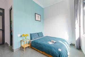 Postel nebo postele na pokoji v ubytování Kim Little Hotel Dalat