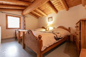 Postelja oz. postelje v sobi nastanitve "L'Ancolie" Appartement de Charme 4 Personnes à Val Cenis