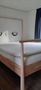Voodi või voodid majutusasutuse Chalet Veluwe G10 Veldkamp 4 Personen toas