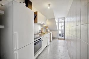 O bucătărie sau chicinetă la home2stay Apartmenthaus Dresden