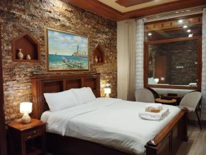 Postelja oz. postelje v sobi nastanitve Durrat Nizwa Hotel