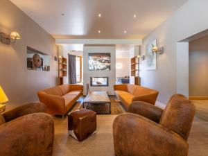 a living room with couches and a table at Chalet Avoriaz, 11 pièces, 16 personnes - FR-1-314-95 in Morzine