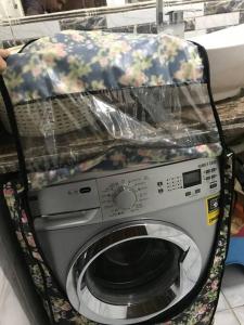 a washing machine with a cover on top of it at Lovely 3-bedroom rental unit.cozy and friendly in Cairo