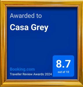 a picture frame with a sign that says awarded to casa grey at Casa Grey in Cambará