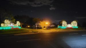 an empty street at night with christmas lights at Family Vacation Home With Pool and Spa Near Disney and Universal in Orlando