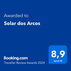 una pantalla azul con el texto concedido al arco de perros solares en Solar dos Arcos, en Praia do Forte