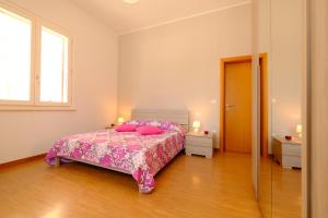 Giường trong phòng chung tại Lady 2 - Pineto Vacanza +5 ảnh