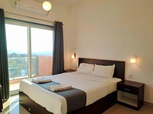 Postel nebo postele na pokoji v ubytování Hotel RSA Residency