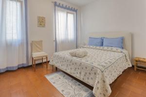 Postel nebo postele na pokoji v ubytování Appartamento Sole d'Estate