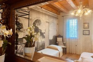 Un pat sau paturi într-o cameră la Al Vecchio Fienile