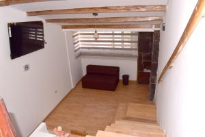 a living room with a couch and a window at Apartaestudio Loft 202 - UE Home in Duitama