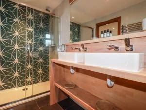 a bathroom with two sinks and a shower at Sea View House in Newquay +33 photos