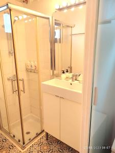 a bathroom with a sink and a shower at Bungalow 4 Binisafua in Binisafua +14 photos