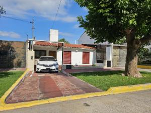 a car parked in front of a house at Chalet Salta in Salta