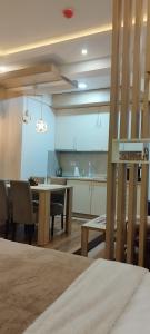 Kuchyň nebo kuchyňský kout v ubytování President Kop Apartman 106