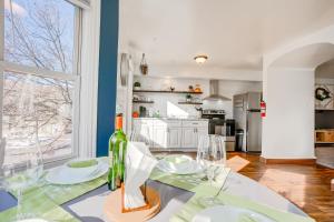 a dining room with a table with wine glasses at Charming Pottstown Apartment - Walk to Town! in Pottstown