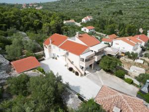 an aerial view of a large white house with orange roofs at Apartman Sorelle in Kali
